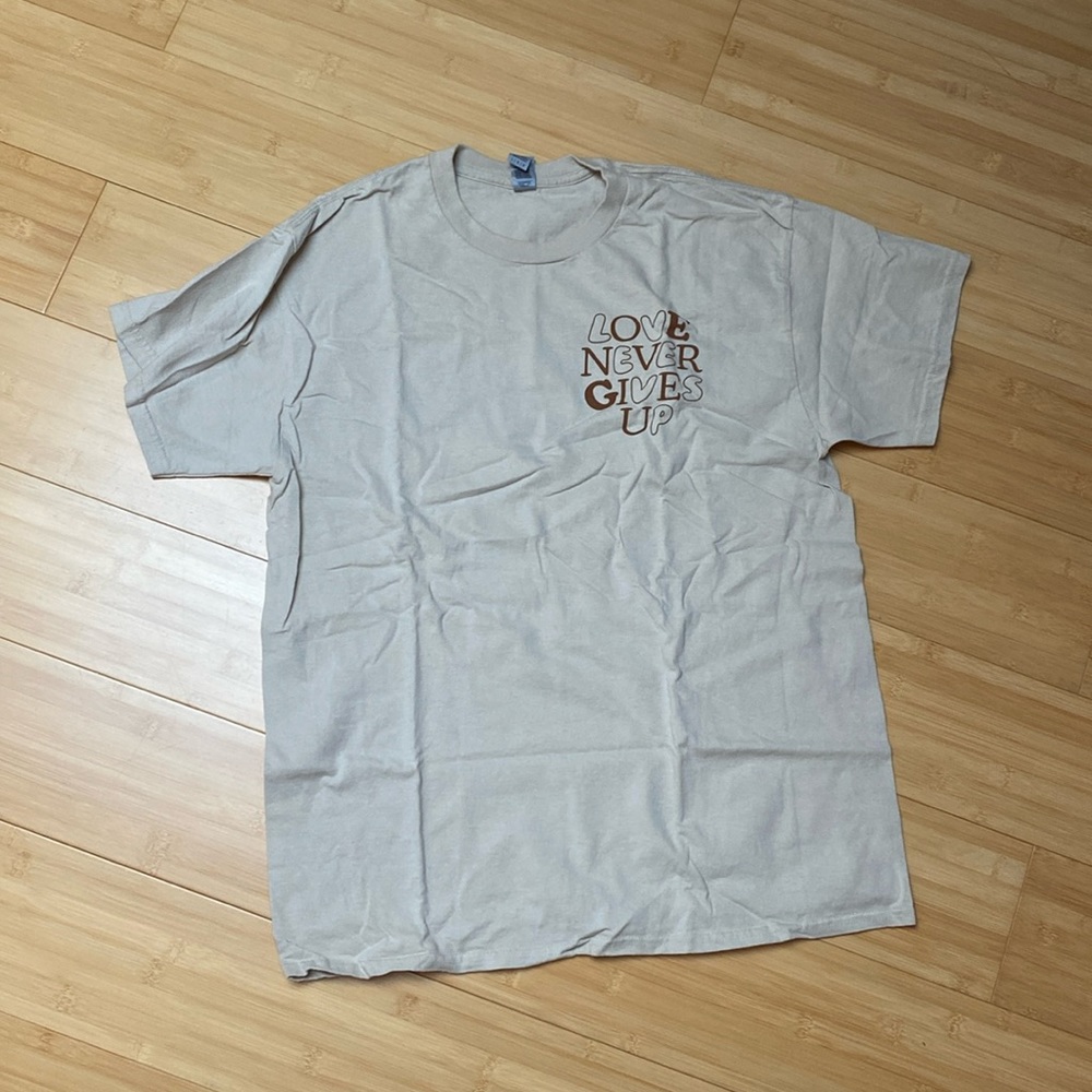 WWJD He Would Love First Love Never Gives Up Brown Tee